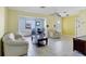 Bright living room with tile floors and open to the adjacent dining space at 3208 Vivienda Blvd, Bradenton, FL 34207