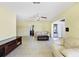 Spacious living room with tile floors, ceiling fan, and neutral wall colors at 3208 Vivienda Blvd, Bradenton, FL 34207