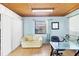 Home office area features light blue walls, wood-paneled ceiling and tile flooring at 3208 Vivienda Blvd, Bradenton, FL 34207