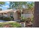 Home exterior with well-maintained landscaping, healthy green lawn, and natural stone entryway at 3296 Tallywood Ct # 7097, Sarasota, FL 34237
