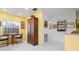 Kitchen with white tile floor, dining table and view to another room at 3296 Tallywood Ct # 7097, Sarasota, FL 34237
