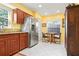 This is a kitchen with stainless steel appliances and a breakfast nook near a window at 3296 Tallywood Ct # 7097, Sarasota, FL 34237