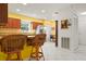 Eat-in kitchen features a breakfast bar, stainless steel appliances, and wood cabinets at 3296 Tallywood Ct # 7097, Sarasota, FL 34237