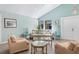 Cozy living room with light-colored walls, comfortable seating, and natural light from the windows at 3296 Tallywood Ct # 7097, Sarasota, FL 34237