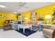 Bright living room featuring two sofas, a glass coffee table and colorful accents with tile floors at 3296 Tallywood Ct # 7097, Sarasota, FL 34237