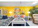 Inviting living room featuring colorful decor, tile floors, and comfortable seating arrangements at 3296 Tallywood Ct # 7097, Sarasota, FL 34237