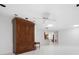 This living room has tiled floors, recessed lighting, and a chandelier-style light fixture at 3296 Tallywood Ct # 7097, Sarasota, FL 34237