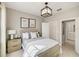 Comfortable bedroom features a stylish headboard, decorative lighting, and a closet for organized storage at 3603 Night Star Terrace, Parrish, FL 34219
