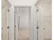 Open view of a walk-in closet with double doors and shelving, providing ample storage space at 3603 Night Star Terrace, Parrish, FL 34219