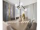 Modern dining room highlighting a stylish light fixture, elegant decor, and sunlit windows at 3603 Night Star Terrace, Parrish, FL 34219