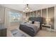 Stylish main bedroom featuring large windows, modern lighting, and neutral decor at 3603 Night Star Terrace, Parrish, FL 34219