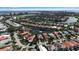 Aerial view of waterfront neighborhood with manicured lawns, golf course at 3617 Fair Oaks Pl, Longboat Key, FL 34228