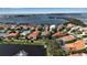 Aerial view of homes in a community overlooking a waterfront at 3617 Fair Oaks Pl, Longboat Key, FL 34228