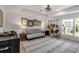 Bonus room features guitars on the wall, comfortable seating, and stylish decor at 3617 Fair Oaks Pl, Longboat Key, FL 34228