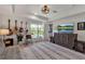 Bonus room boasts guitars, tv and large decorative rug, creating a unique space at 3617 Fair Oaks Pl, Longboat Key, FL 34228