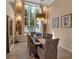 Elegant dining room featuring a large bay window and stylish decor at 3617 Fair Oaks Pl, Longboat Key, FL 34228