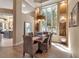 Elegant dining room featuring a large bay window and stylish decor at 3617 Fair Oaks Pl, Longboat Key, FL 34228