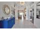 Bright foyer features decorative mirror, chandelier, and open floor plan at 3617 Fair Oaks Pl, Longboat Key, FL 34228