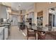 Spacious kitchen with stainless steel appliances, granite countertops, center island, and adjacent breakfast nook at 3617 Fair Oaks Pl, Longboat Key, FL 34228