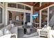 Covered lanai boasts comfortable seating and stunning views of the interior and lake at 3617 Fair Oaks Pl, Longboat Key, FL 34228
