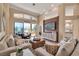 Open living space with modern decor, a large wall-mounted television, and seamless access to the lanai and outdoor areas at 3617 Fair Oaks Pl, Longboat Key, FL 34228