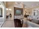 Spacious living area featuring a TV wall, comfortable seating, and seamless transition to the dining area and outdoor patio at 3617 Fair Oaks Pl, Longboat Key, FL 34228
