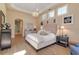 Comfortable main bedroom with light wood floors, neutral tones, and sophisticated decor at 3617 Fair Oaks Pl, Longboat Key, FL 34228