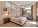 Elegant main bedroom with large windows, stylish furnishings, and wood floors at 3617 Fair Oaks Pl, Longboat Key, FL 34228
