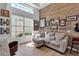 Comfortable office area with a rustic wooden wall, and a large window at 3617 Fair Oaks Pl, Longboat Key, FL 34228