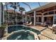 Swimming pool and jacuzzi spa on a paved outdoor patio at 3617 Fair Oaks Pl, Longboat Key, FL 34228