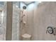 Walk-in shower features glass block partition, rainfall shower head, and tiled walls at 3617 Fair Oaks Pl, Longboat Key, FL 34228