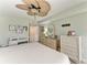 Comfortable bedroom setup with a desk and a neutral decor at 3805 E Bay Dr # 301, Holmes Beach, FL 34217