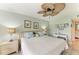 This bedroom is well-lit and features coastal-style furnishings at 3805 E Bay Dr # 301, Holmes Beach, FL 34217