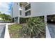 Attractive condo building with well-maintained landscaping at 3805 E Bay Dr # 301, Holmes Beach, FL 34217