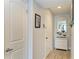 Bright hallway with coastal decor and ample storage at 3805 E Bay Dr # 301, Holmes Beach, FL 34217