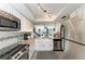Bright kitchen features stainless steel appliances, granite countertops, and stylish backsplash at 3805 E Bay Dr # 301, Holmes Beach, FL 34217