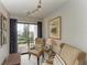 The living room features comfortable seating and an open view of the lush green landscape at 3805 E Bay Dr # 301, Holmes Beach, FL 34217
