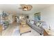 Open concept living area with updated flooring, comfortable seating, and coastal-inspired decor at 3805 E Bay Dr # 301, Holmes Beach, FL 34217