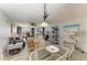 Bright open concept living and dining area with elegant coastal decor and plenty of natural light at 3805 E Bay Dr # 301, Holmes Beach, FL 34217