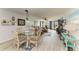 Open-concept living area with dining space and bright natural light at 3805 E Bay Dr # 301, Holmes Beach, FL 34217