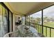Comfortable patio with dining set and seating area that features a lush landscape at 3805 E Bay Dr # 301, Holmes Beach, FL 34217