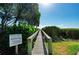 Boardwalk leading to the beach for residents & guests of Sunbow Bay at 3805 E Bay Dr # 301, Holmes Beach, FL 34217