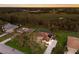 An aerial shot of a well maintained home with a pool and a large backyard overlooking a field at 3902 162Nd E Ave, Parrish, FL 34219