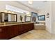 Large bathroom features double sinks, granite countertops and a luxurious soaking tub at 3902 162Nd E Ave, Parrish, FL 34219