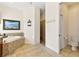 Bathroom featuring a soaking tub with tile surround, shower, and toilet at 3902 162Nd E Ave, Parrish, FL 34219