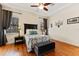 Inviting bedroom with hardwood floors, a ceiling fan, and natural light from two windows at 3902 162Nd E Ave, Parrish, FL 34219