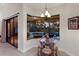 Bright breakfast nook with a round glass table and seating, with views of the outdoor pool at 3902 162Nd E Ave, Parrish, FL 34219
