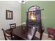 Dining area featuring a dark wood table and a view of the sunset through the window at 3902 162Nd E Ave, Parrish, FL 34219