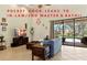 Bright living room boasts tile floors, ceiling fan and views of the outdoor lanai and pool at 3902 162Nd E Ave, Parrish, FL 34219