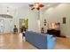 Open-concept living area with high ceilings and views into the home office at 3902 162Nd E Ave, Parrish, FL 34219